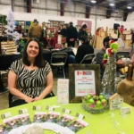 Tiffany (office manager of Just Like Family Home Care Fraser Valley) running a booth at the Abbotsford Craft Fair