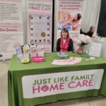 Katie (Caregiver of Just Like Family Home Care Fraser Valley) running a booth on the Womens Show in Abbotsford